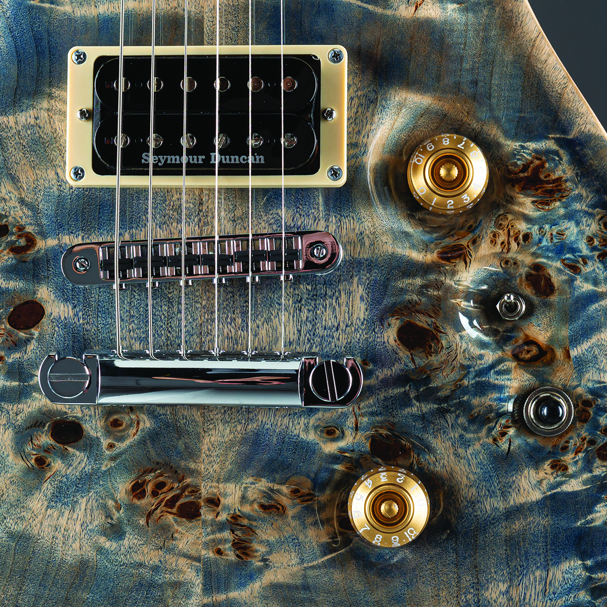 A detail photo of a Fame Forum IV Modern 20th Anniversary in Burl Stonewashed Blue