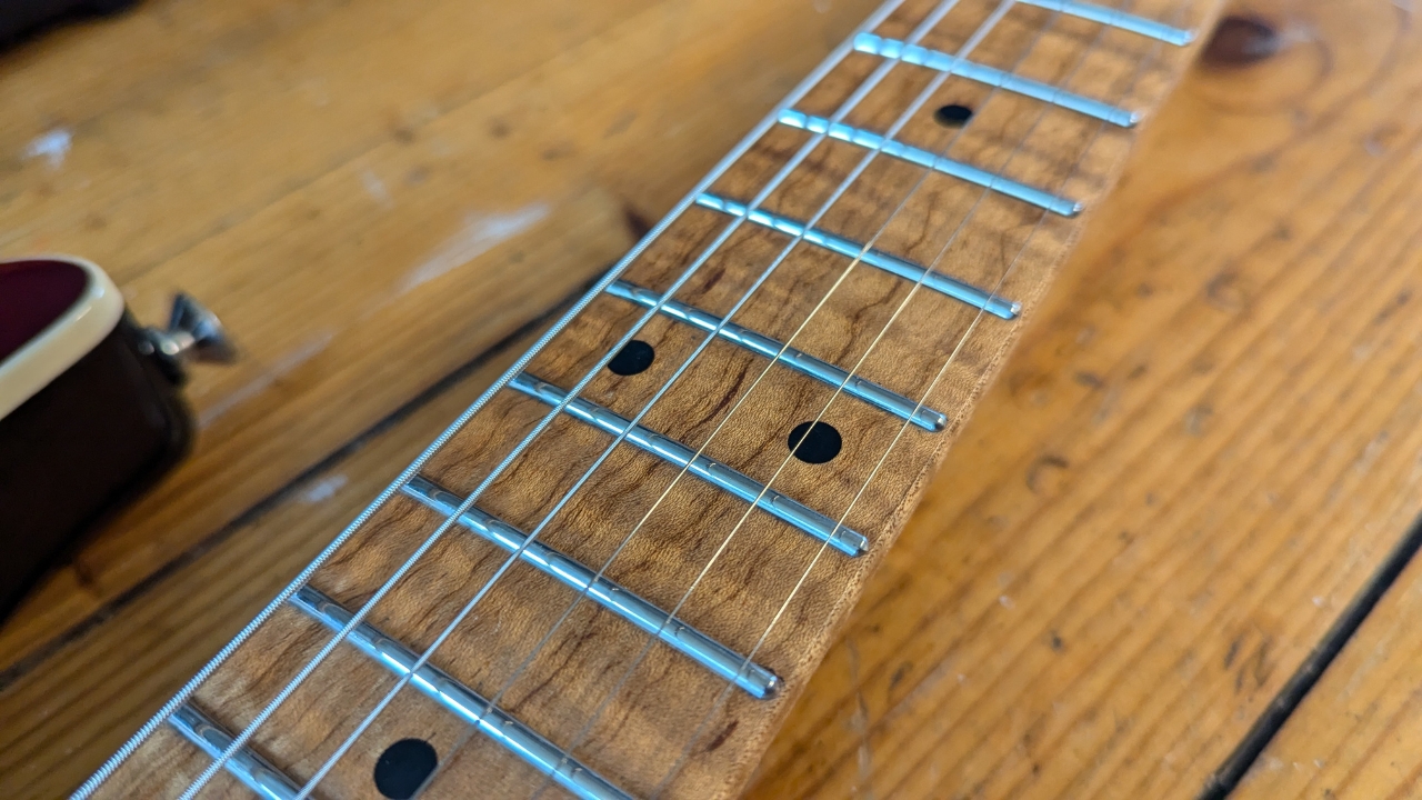 The fretboard of a Harley Benton ST-Modern Plus