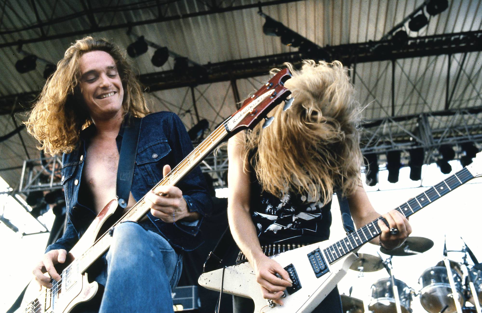 Cliff Burton (left) and James Hetfield perform onstage with Metallica