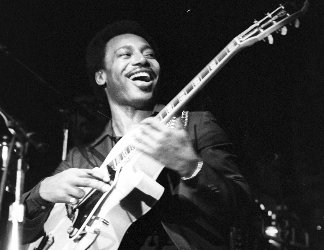 Photo of George Benson performing onstage circa 1976