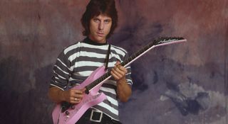 Jeff Beck wears a hooped T-shirt and plays his pink Jackson Soloist, so-called 