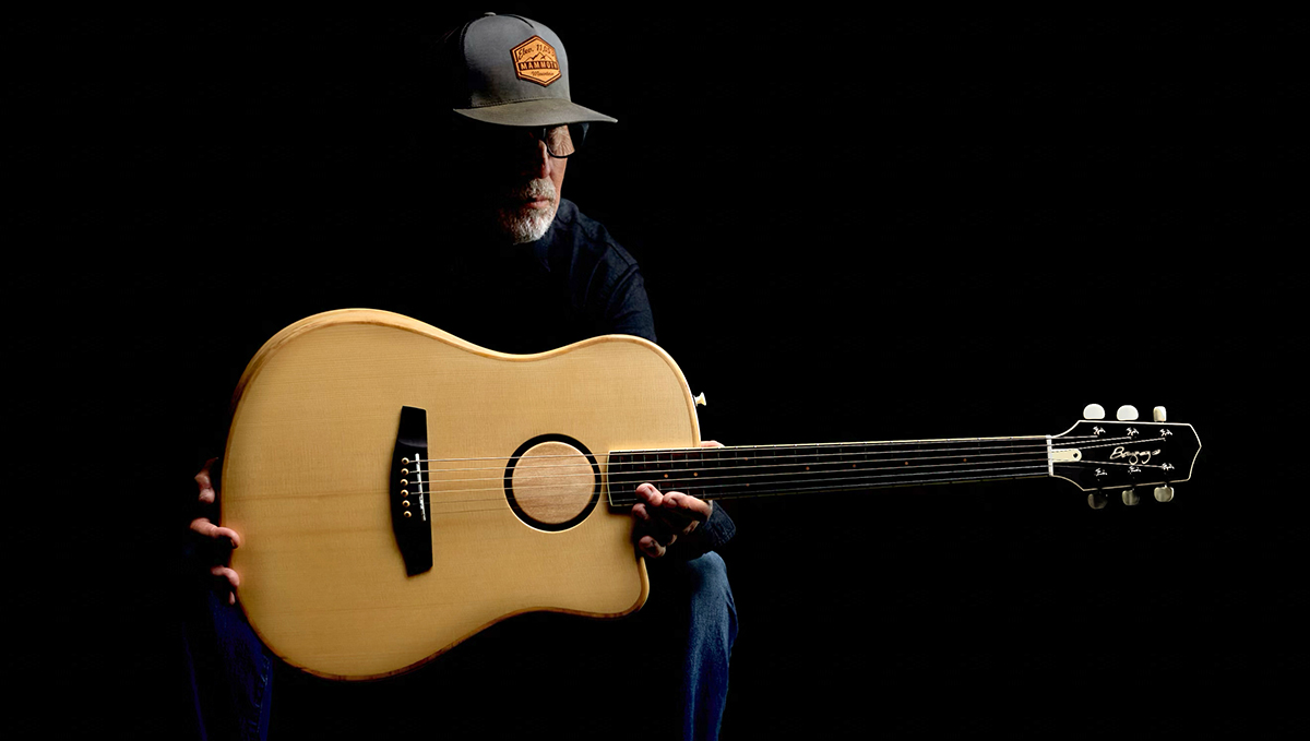 A man holds the L.R. Baggs AEG-1 acoustic-electric guitar