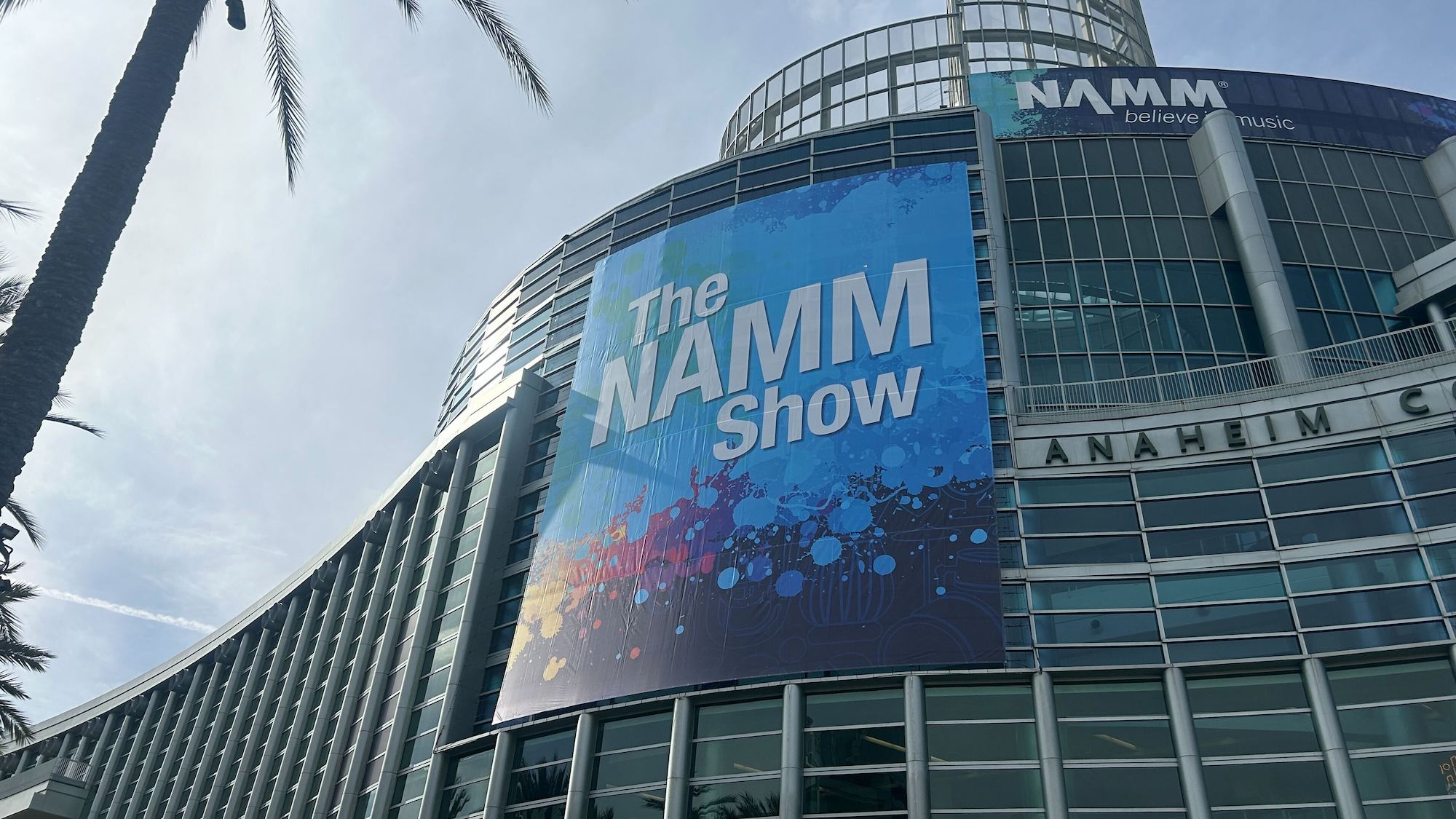 A poster advertising the 2025 NAMM show adorns the front of the Anaheim Convention Center in Anaheim, California