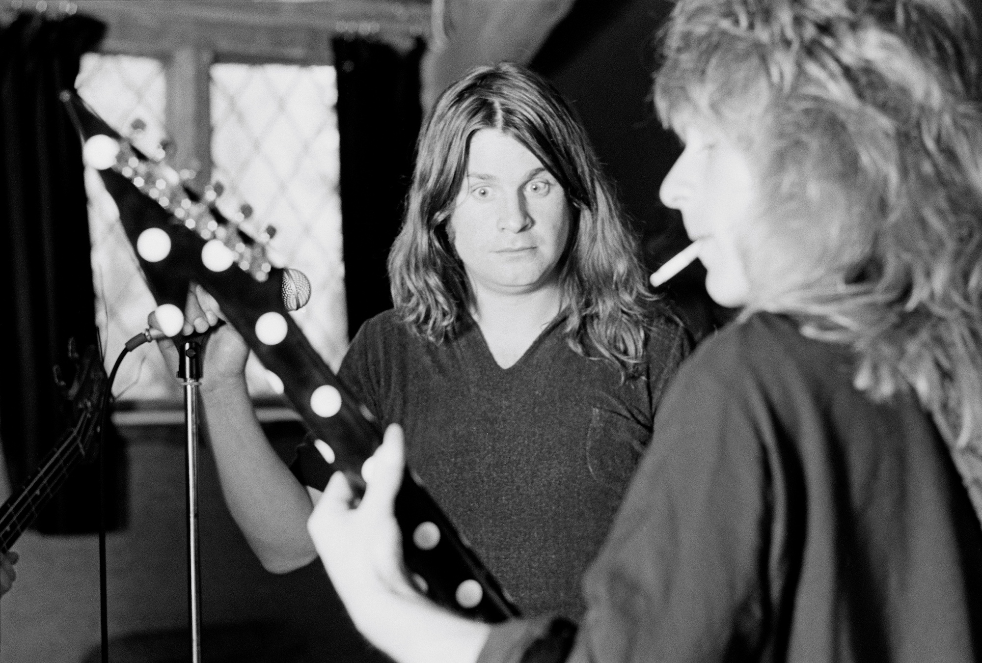 Ozzy Osbourne watches Randy Rhoads play at Ridge Farm Studio in West Sussex, England in May 1980