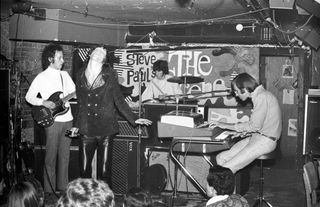 (from left) Robby Krieger, Jim Morrison, John Densmore, and Ray Manzarek perform onstage at Steve Paul's The Scene nightclub in New York City on June 27, 1967