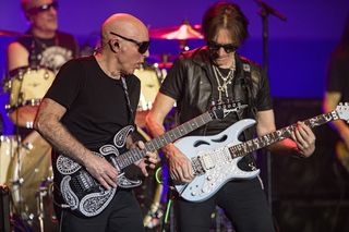 Joe Satriani (L) and Steve Vai perform on stage during the G3 tour stop at The Magnolia on February 07, 2024 in El Cajon, California.