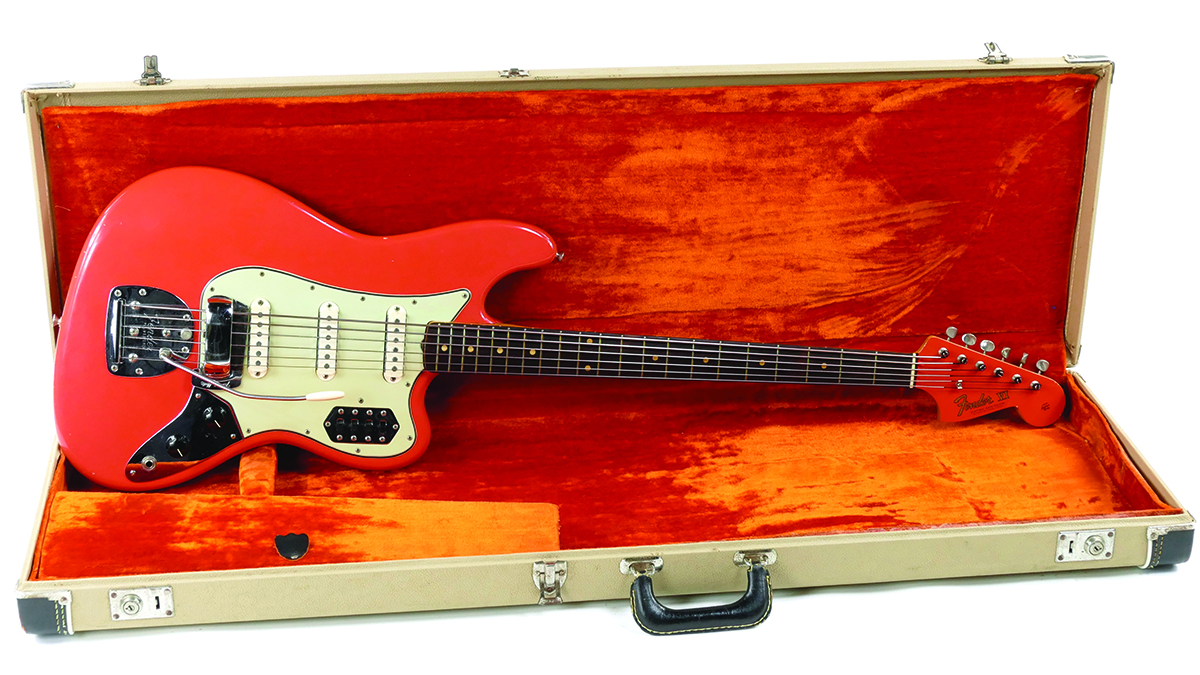 A 1962 Fender Bass VI in Shell Pink sits in its case.