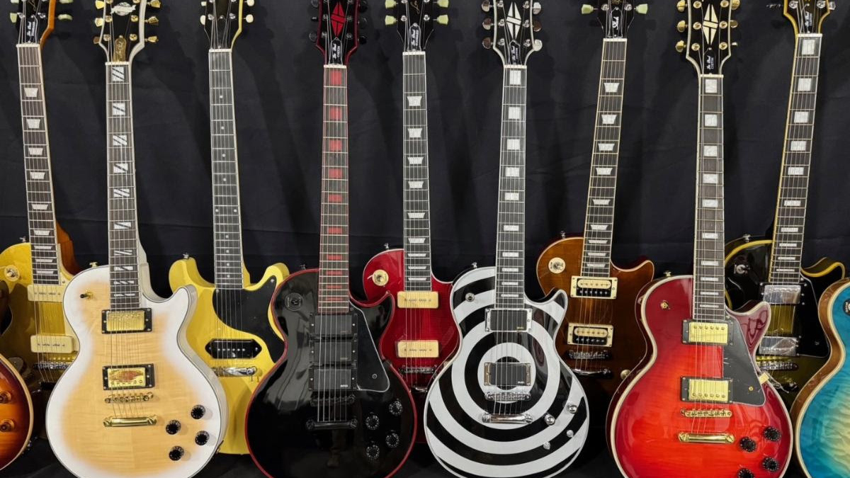 A group of fake Gibson Les Pauls are lined up after being seized by U.S. Customs and Borders Protection officers in November 2024.