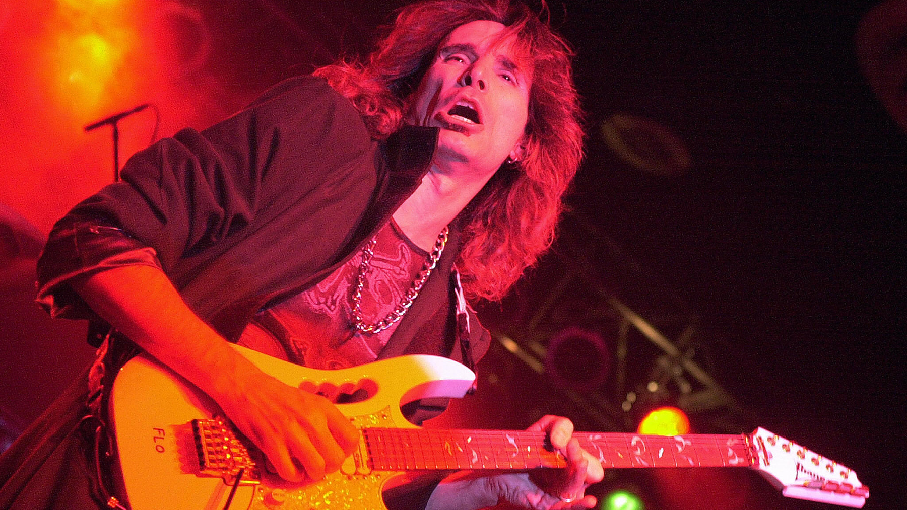 US rock guitarist Steve Vai performs during a concert at the Hong Kong International Trade and Exhibition Centre (HITEC), 03 August 2004. Vai, who was once a member of US legend Frank Zappa's band as well as 1980s rockers Whitesnake, is currently touring with his band in Asia and Australia -- heading next to Beijing.