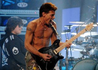 Wolfgang Van Halen (left, background) and Eddie Van Halen perform onstage at the Verizon Center in Washington, D.C. on November 1, 2007