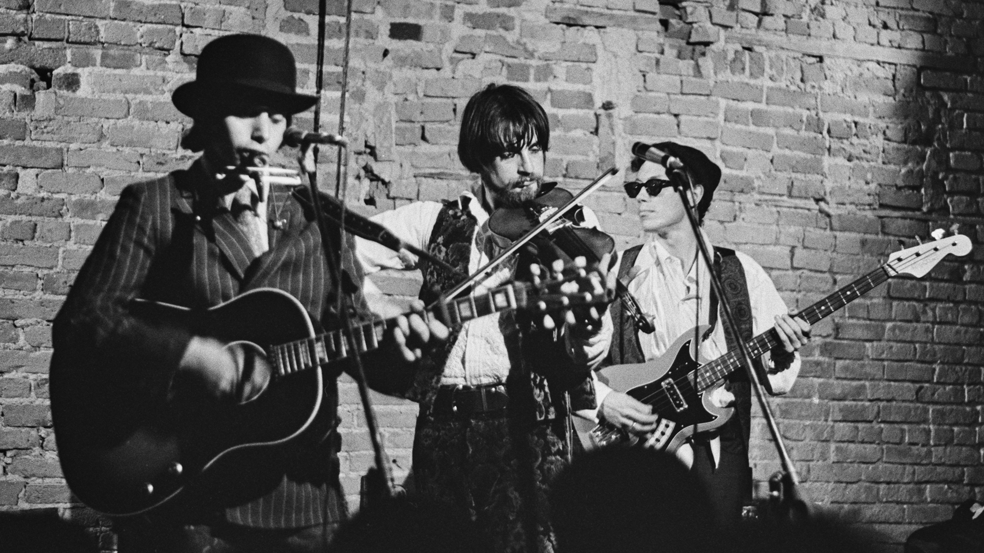 American rock band Dr West's Medicine Show and Junk Band (American singer-​songwriter Norman Greenbaum, American musician Jack Carrington, and American bass player Evan Engber) perform live on stage, location unspecified, April 1967. The band's singer, Bonnie Zee Wallach, is out of shot. Greenbaum would have a 1969 hit as a solo artist with 