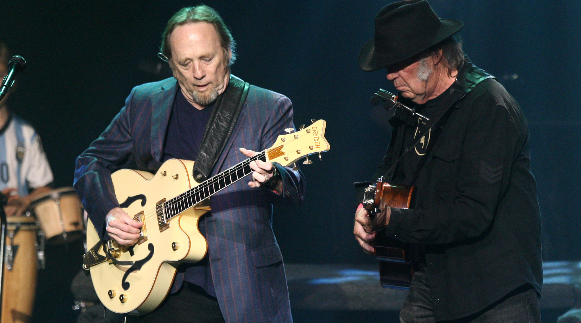 Stephen Stills (L) and Neil Young perform on stage during the 3rd Light Up the Blues Concert to benefit Autism Speaks held at the Pantages Theatre on April 25, 2015 in Hollywood, California