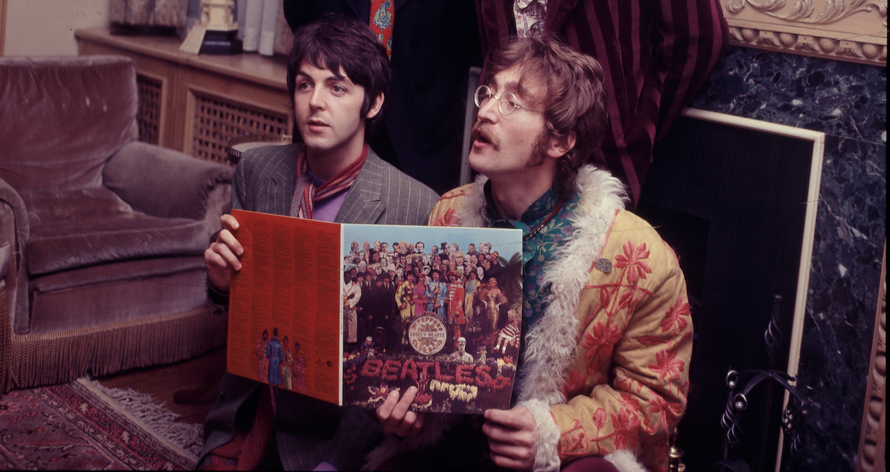 The Beatles pose for the press with their newly completed album, 'Sergeant Pepper's Lonely Hearts Club Band', at the press launch for the album, held at manager Brian Epstein's house at 24 Chapel Street, London, 19th May 1967. Clockwise from top left: Ringo Starr, George Harrison (1943 - 2001), John Lennon (1940 - 1980) and Paul McCartney.