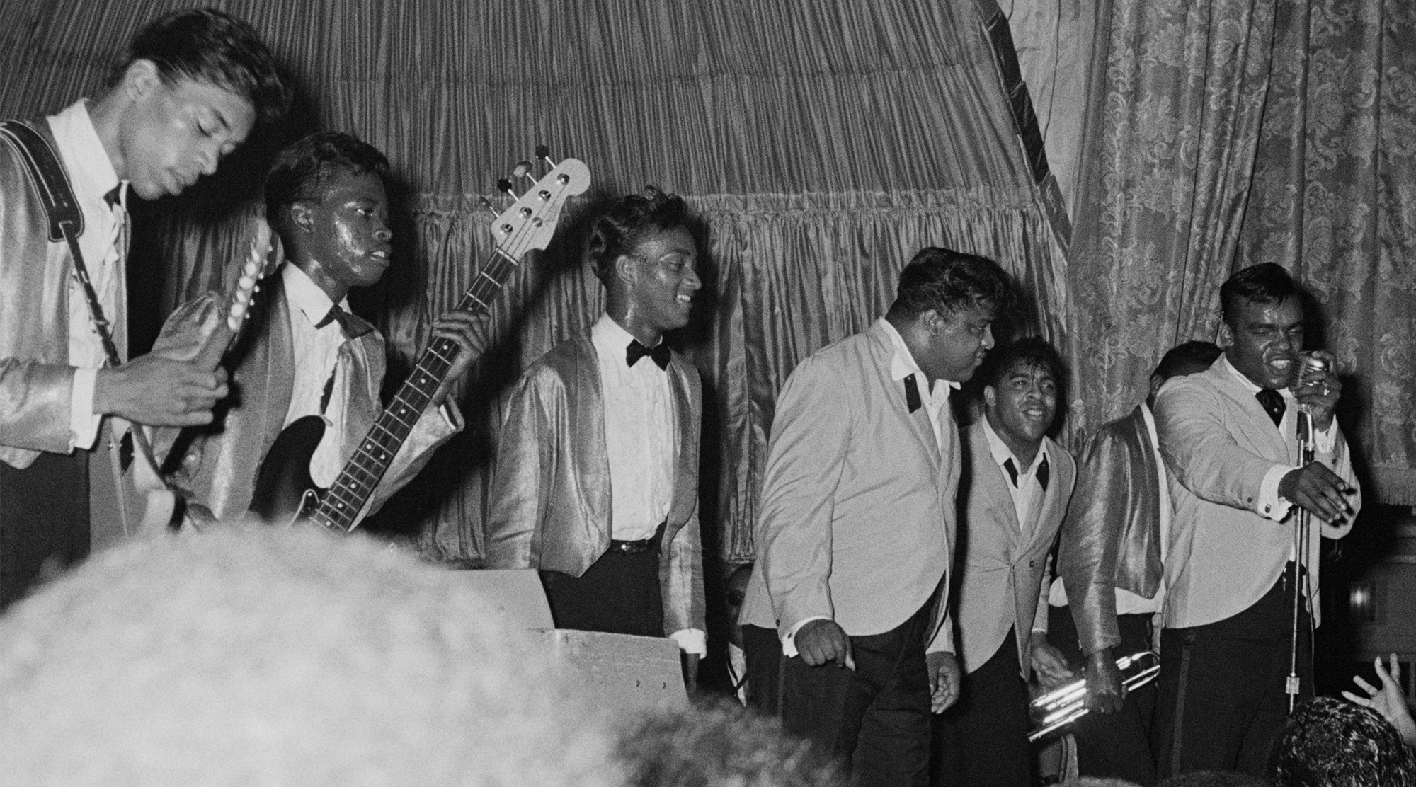 The Isley Brothers perform at a farewell party for R&B disc jockey Nathaniel 'Magnificent' Montague at the Rockland Palace in Harlem, New York City, on June 19, 1964. Guitarist Jimi Hendrix (1942 - 1970) is at far left.