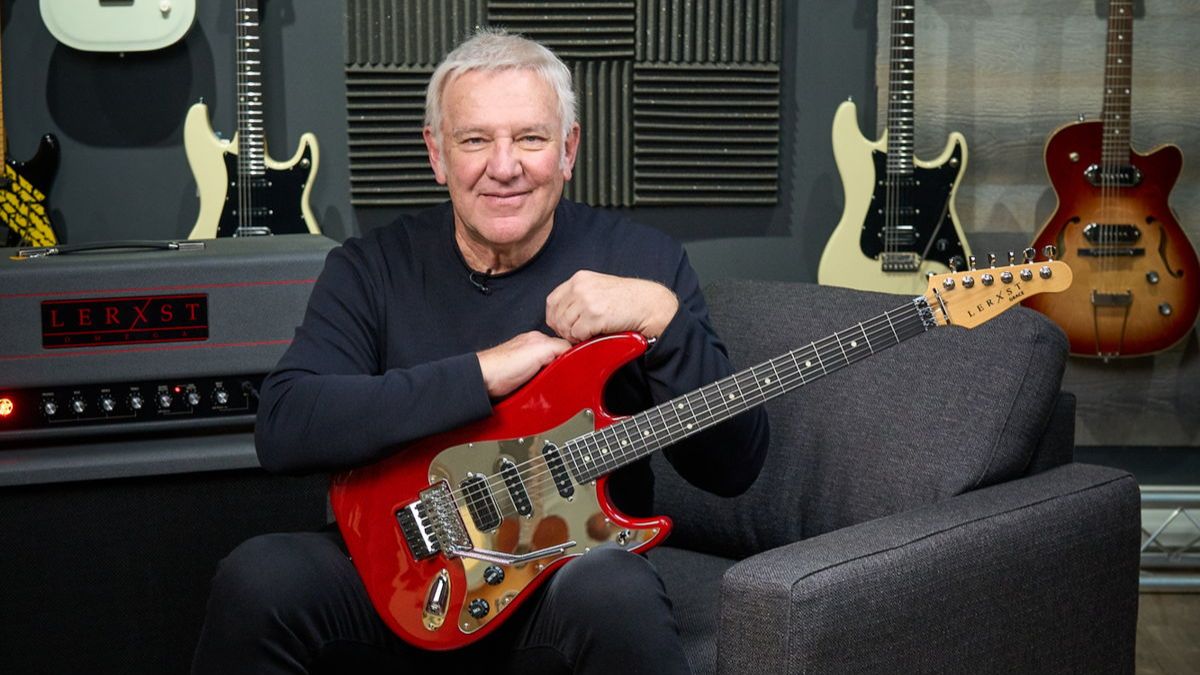 Alex Lifeson holds his Lerxst Grace guitar