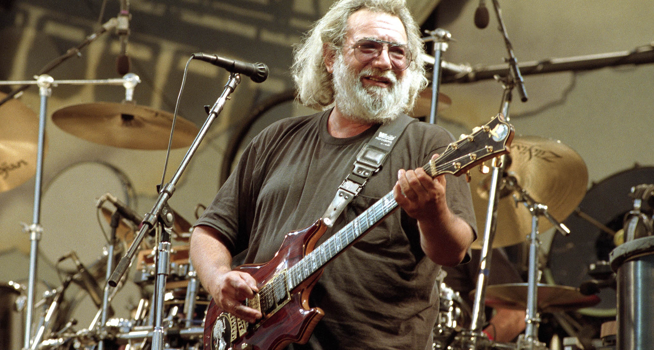 Jerry Garcia performs with his custom Dough Irwin Rosebud at a Grateful Dead gig in 1991, California.