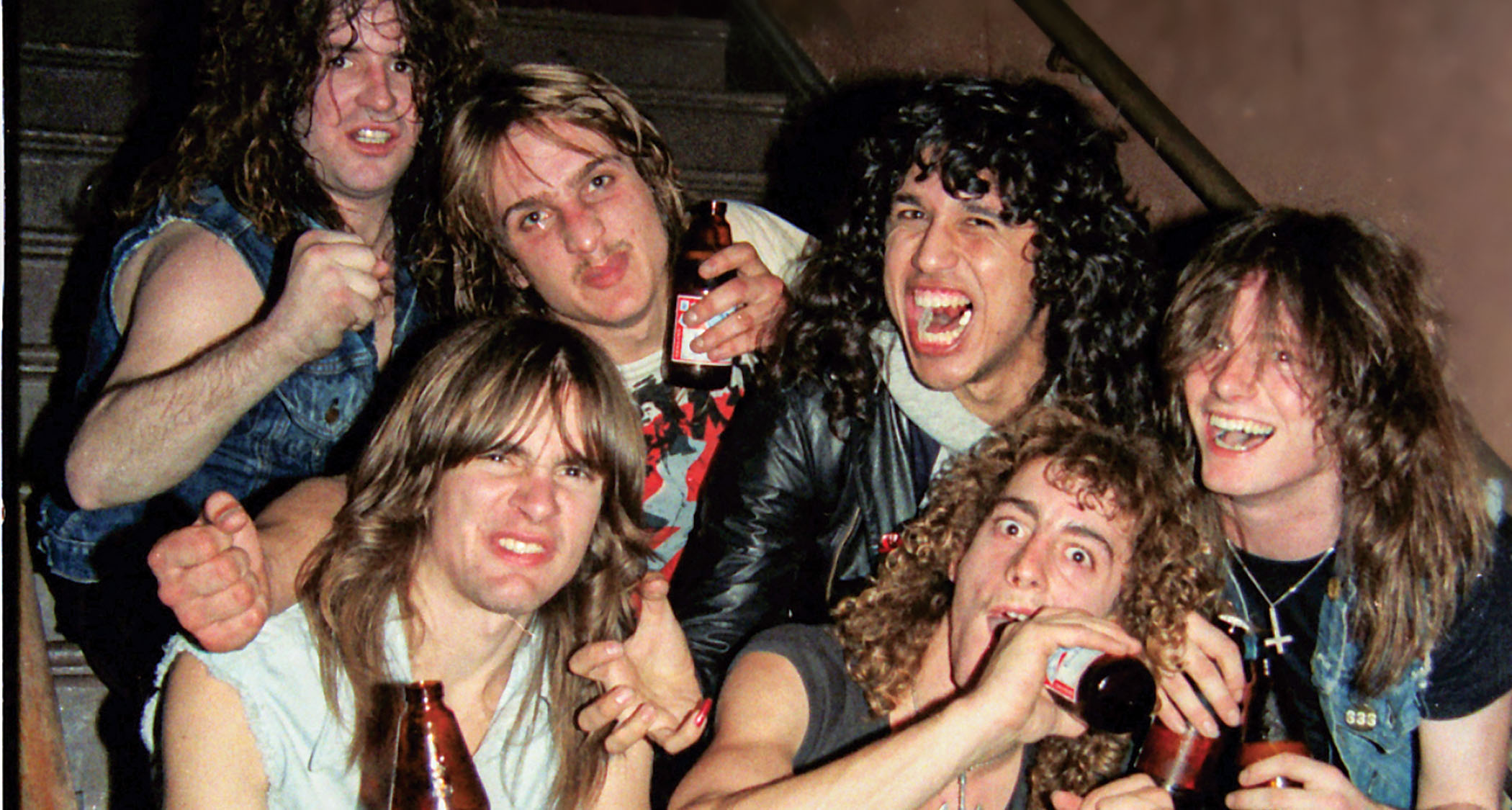 “Exodus with Slayer’sTom Araya [third from right] backstage at Wolfgang’s in 1984,” Holt says