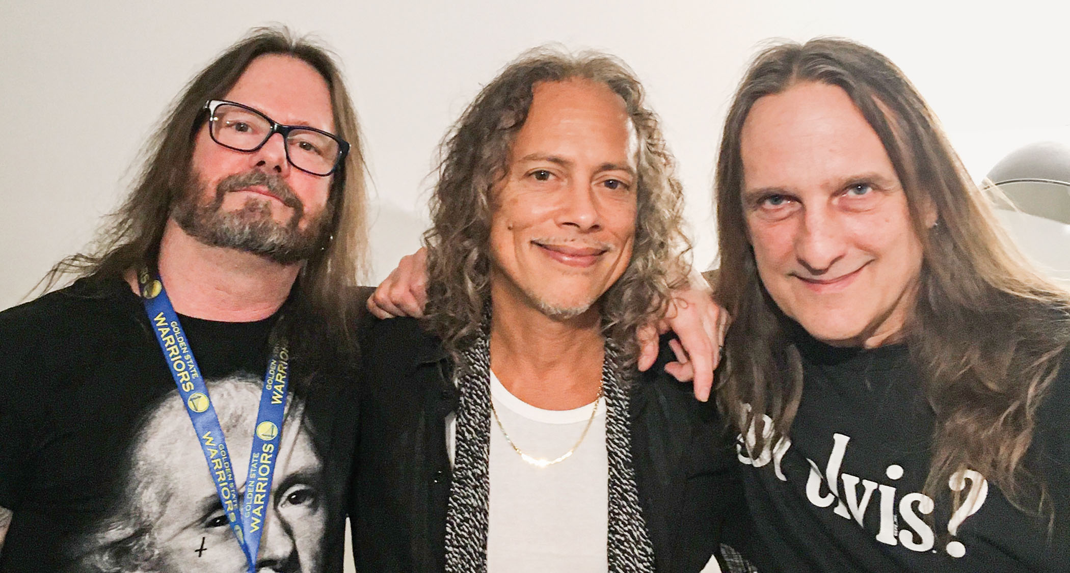 “Tom Hunting [right] and I having a backyard- party-days reunion with Kirk Hammett [center] in Paris,” Holt says
