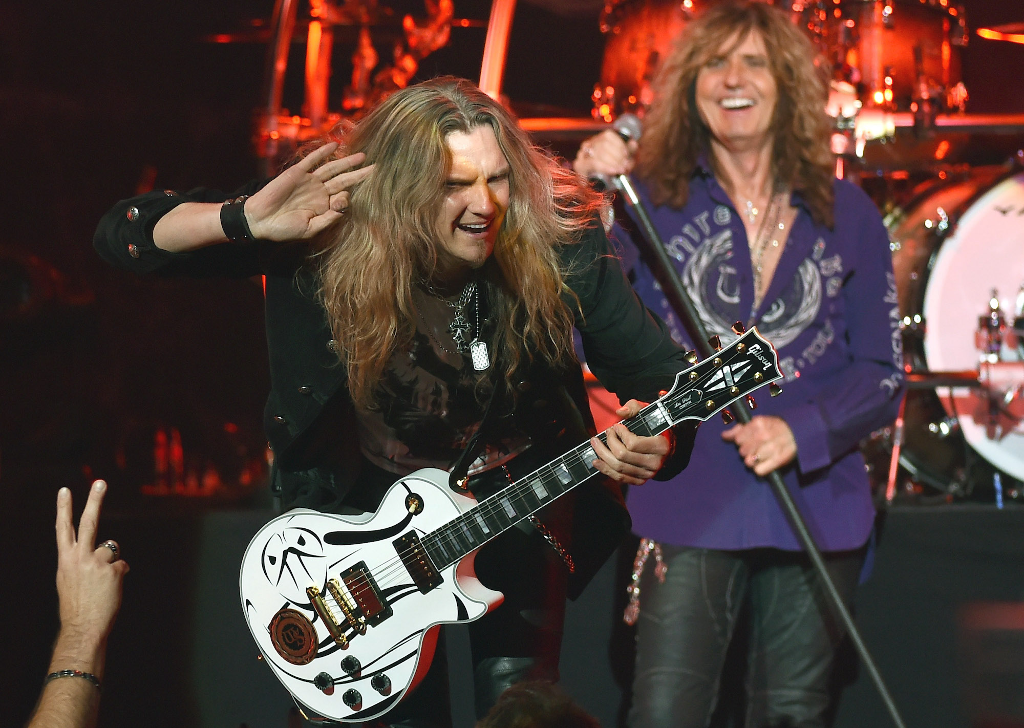 Joel Hoekstra (left) and David Coverdale perform onstage with Whitesnake at the Hard Rock Hotel & Casino in Las Vegas, Nevada on June 4, 2015