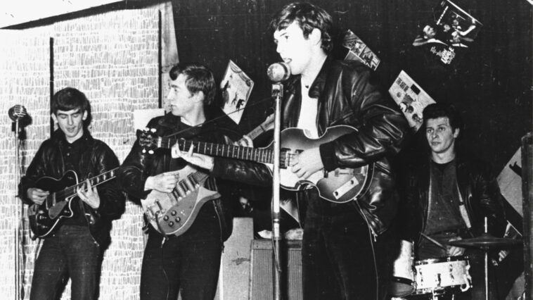 British rock group The Beatles perform in a club prior to signing their first recording contract, Liverpool, England, 1962. L-R: George Harrison, John Lennon, Paul McCartney, and original drummer Pete Best.