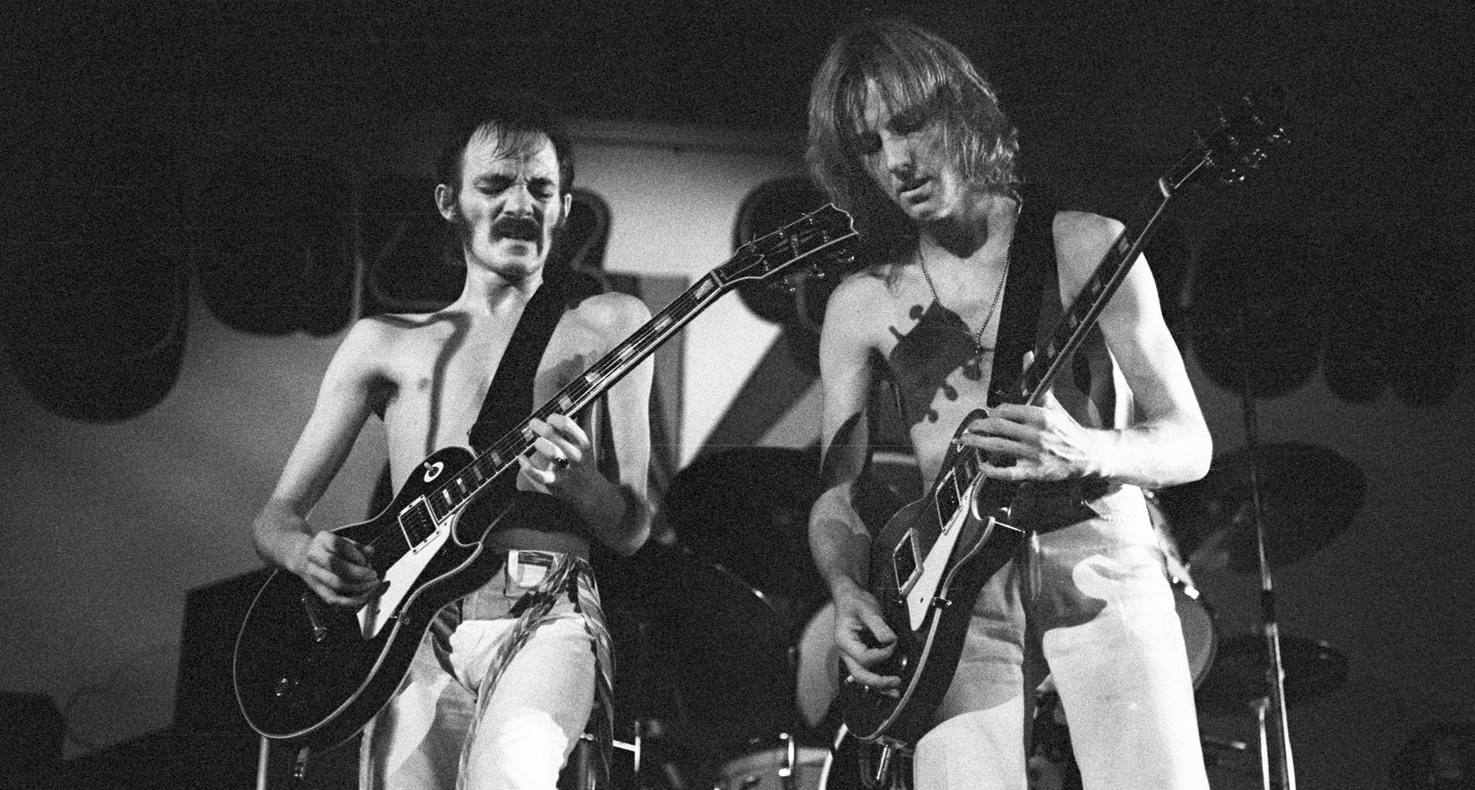 A black-and-white live shot of Steve Marriott (left) and Clem Clempson performing with Humble Pie in 1974