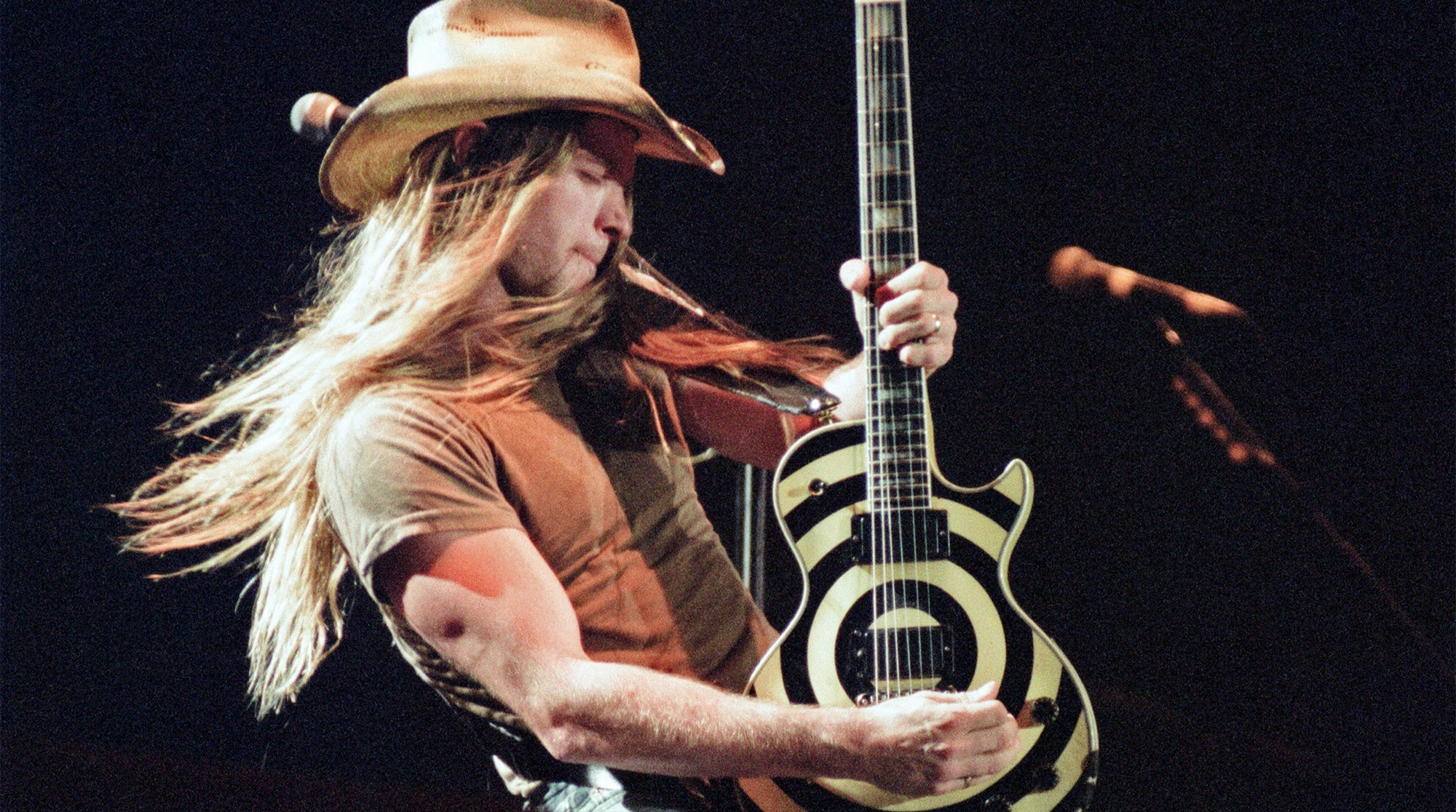 Zakk Wylde performs live on stage, playing his Gibson Les Paul Custom bullseye guitar. 26th June 1994. Gibson guitars celebrate their 100th anniversary with the concert "Night of 100 Guitars", at Wembley Arena