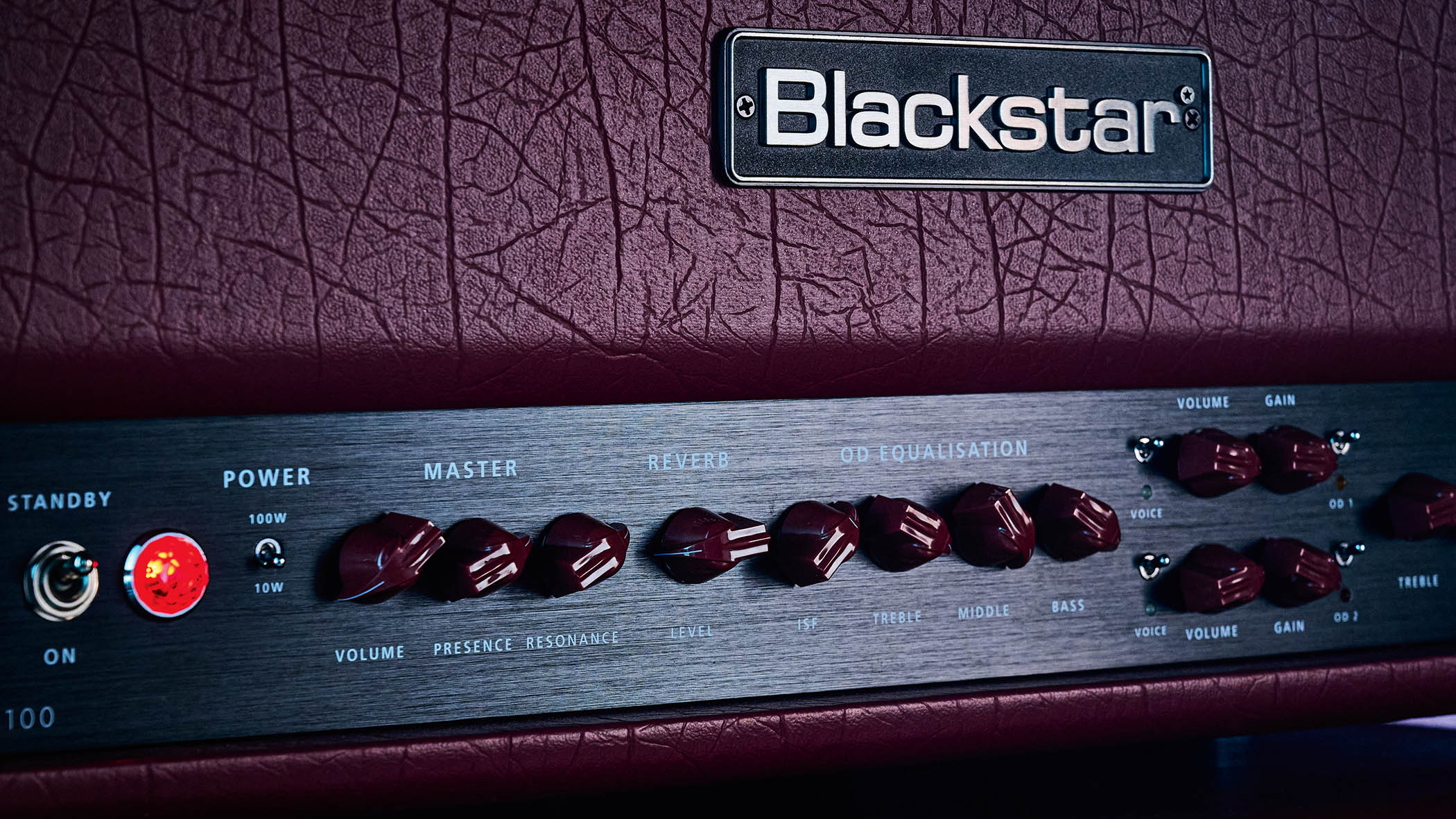 Doug Aldrich's signature amp, the Blackstar DA100, is photographed in moody low-light situations.
