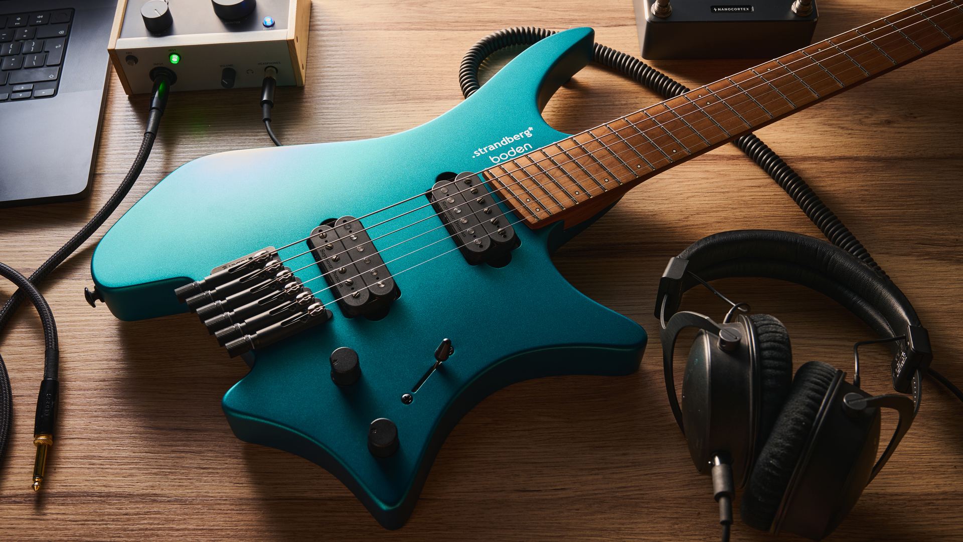 Strandberg N2 Boden Standard in Transformative Teal, shot in close-up and against a pale wooden floor.
