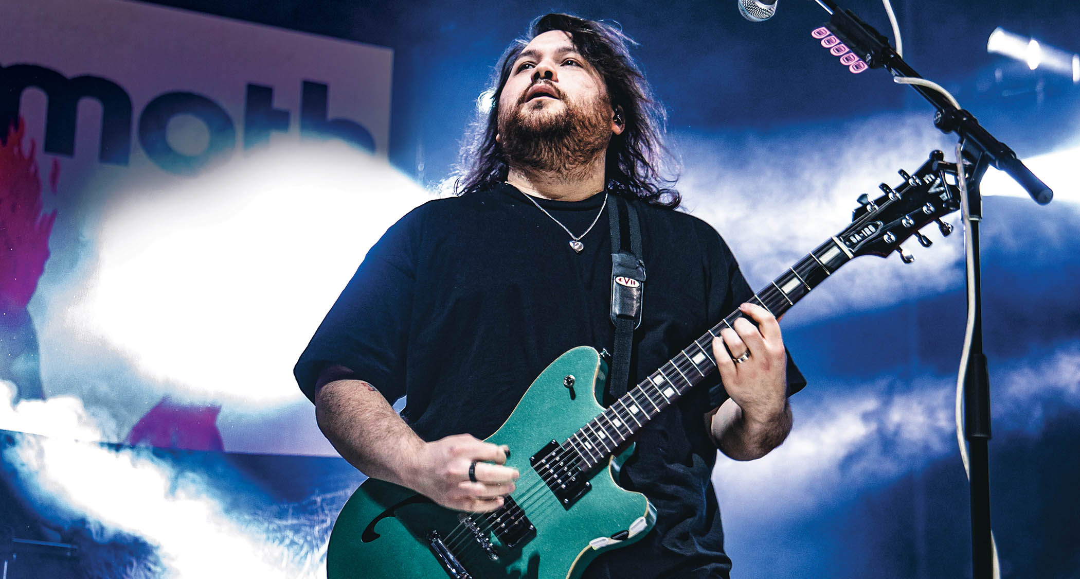 Wolfgang Van Halen performs live with his signature EVH semi-hollow in green