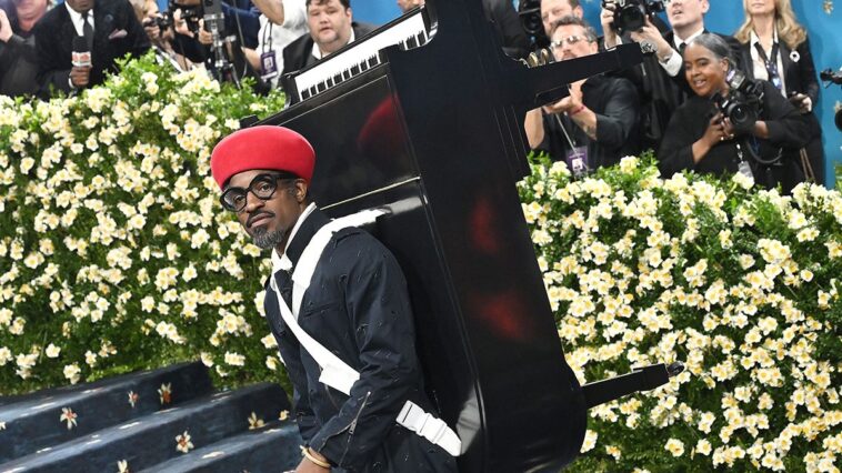 "André 3000's 2025 Met Gala Appearance with a Grand Piano: The Hilarious 'Worst Rap Album' Due to Its Complete Lack of Lyrics"]