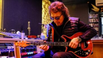 Brian May Presents Tony Iommi with a Redesigned Red Special Featuring SG Modifications]