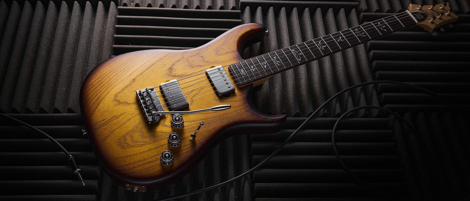 “Discover the sophisticated tones without the hassle of single coil hum... an almost ideal functional gig guitar: PRS Fiore HH Satin Review”]