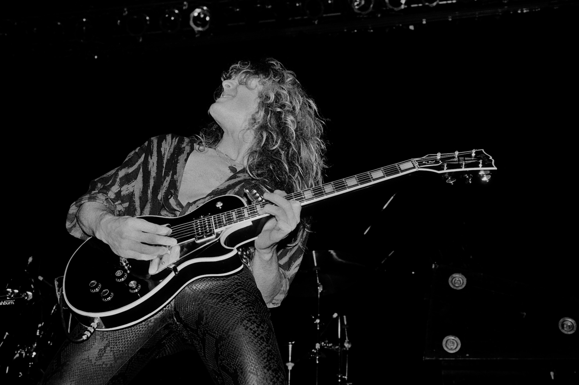 John Sykes performs onstage with Whitesnake at the UIC Pavilion in Chicago, Illinois on November 10, 1984