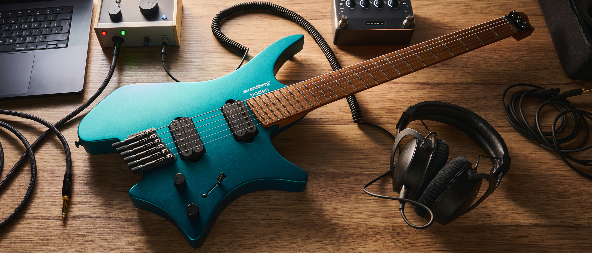 Strandberg N2 Boden Standard in Transformative Teal, shot in close-up and against a pale wooden floor.
