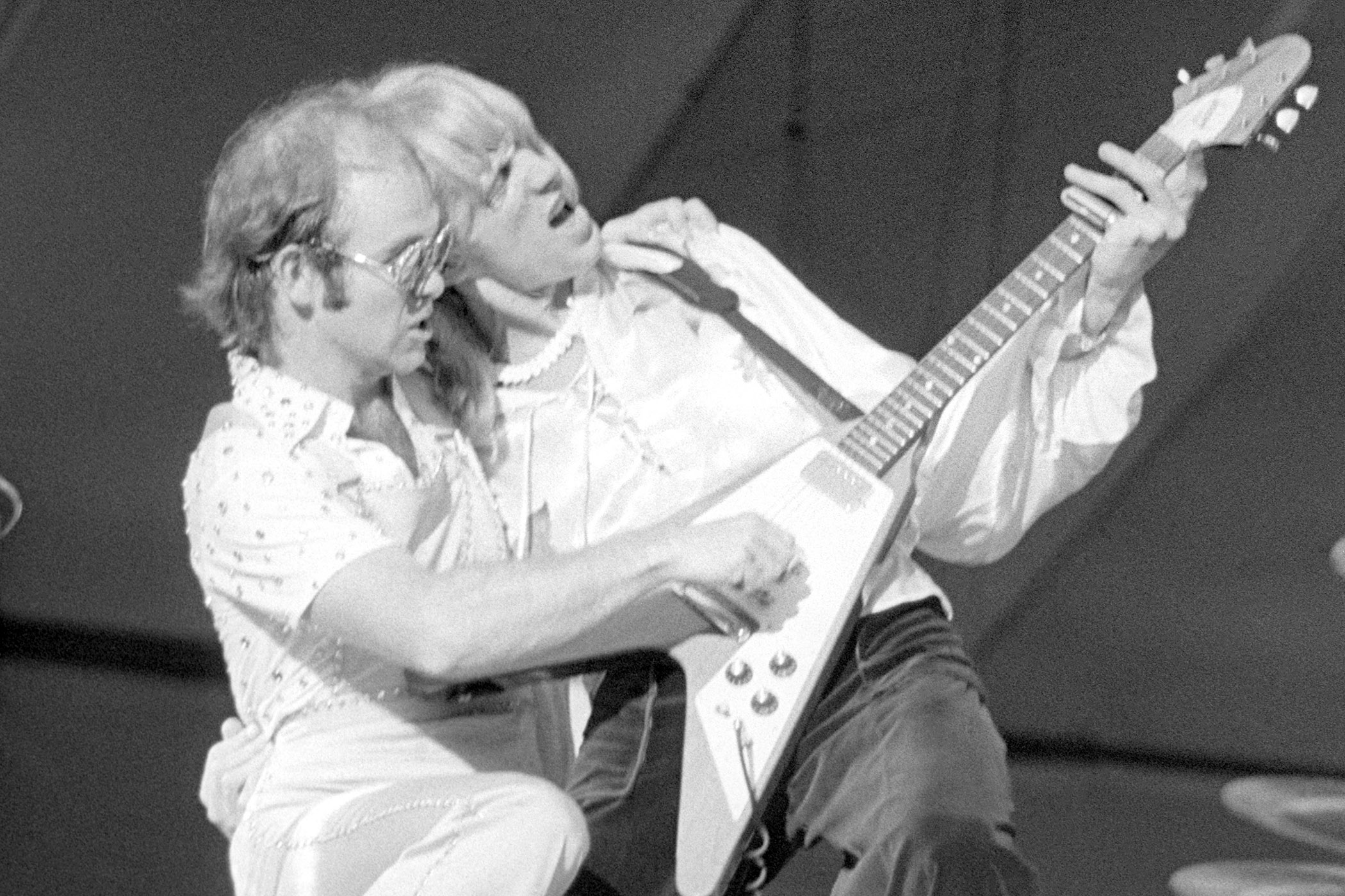 An iconic black-and-white pic of Elton John and Davey Johnstone performing at Dodger Stadium during the West of the Rockies Tour 1975.