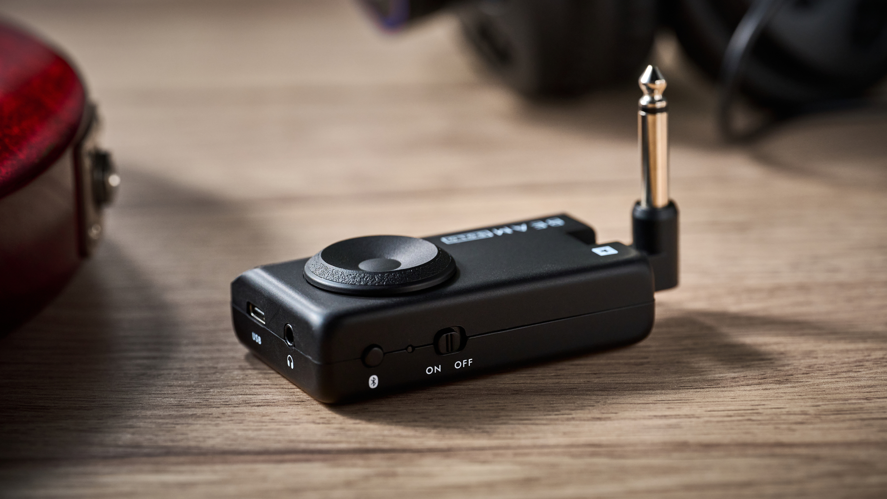 A Blackstar Beam Solo headphone amp for guitar on a wooden table