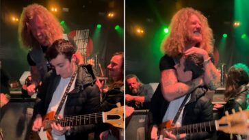 Jared James Nichols passes his guitar to a pedal maker during a solo performance.]