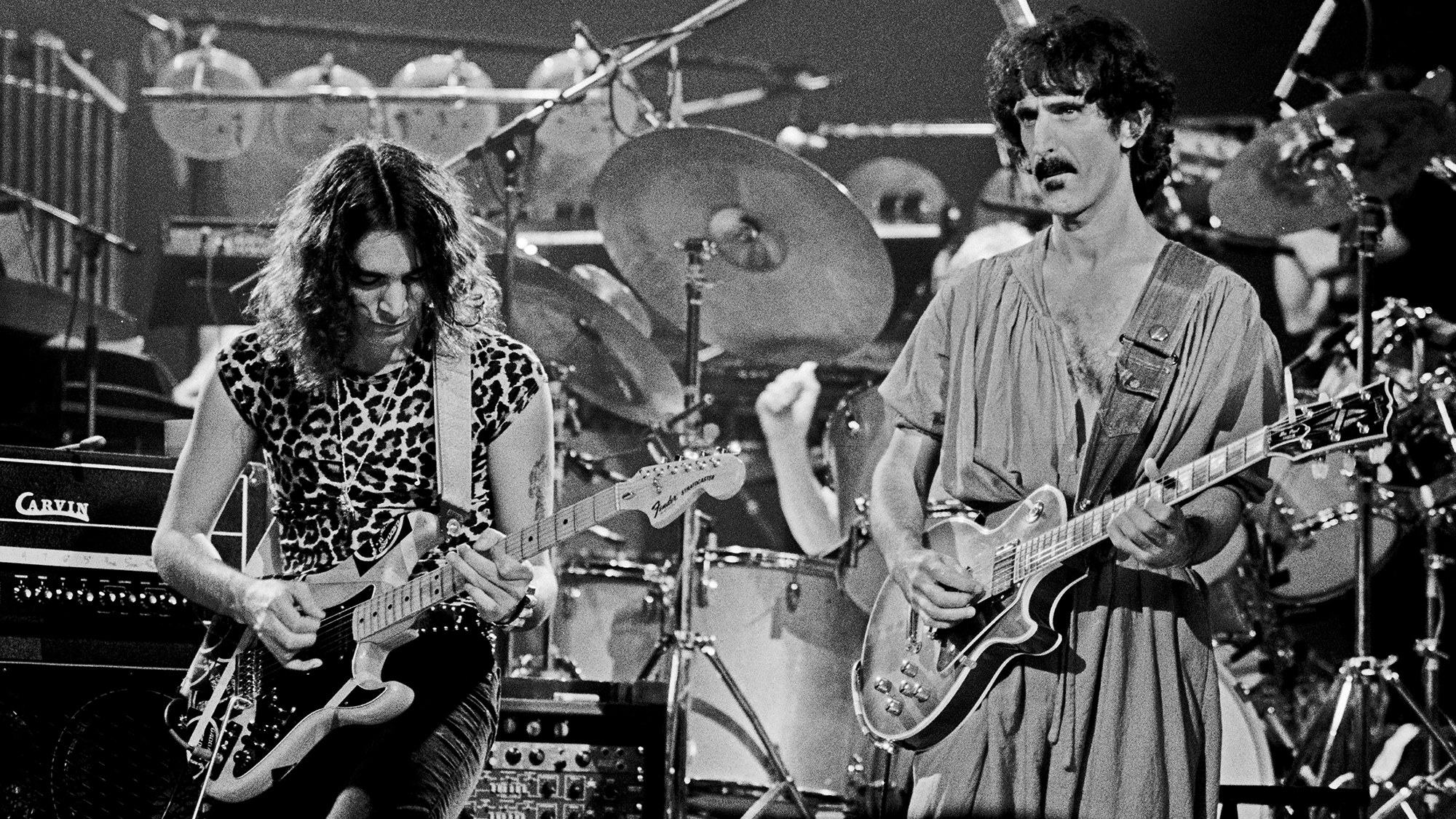 American musicians Steve Vai (left) and Frank Zappa (1940 - 1993), both on guitar, perform on stage at the Palladium, New York, New York, October 31, 1981.