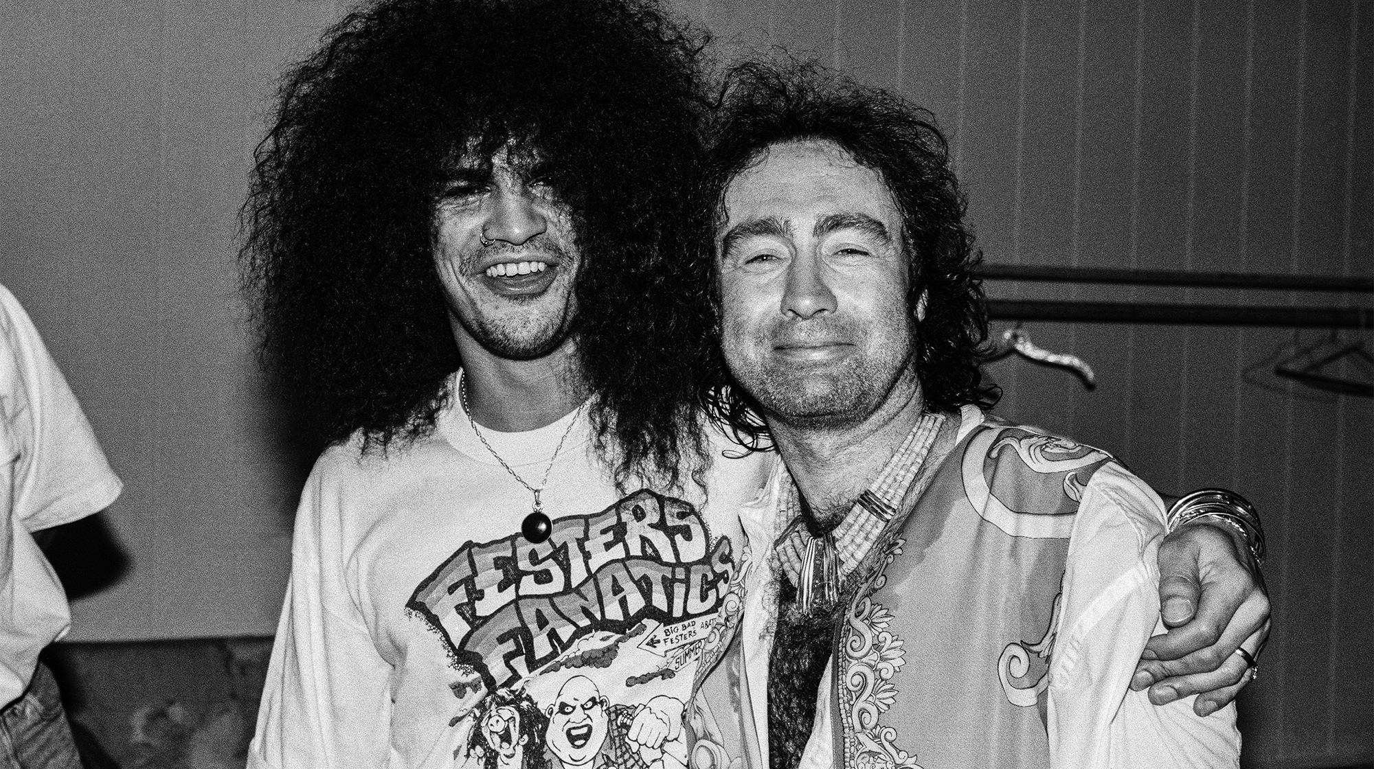 (L-R) English musicians Slash, of Guns N' Roses, and Paul Rodgers, of Bad Company, pose for a portrait at an event in Los Angeles, California, circa 1990.