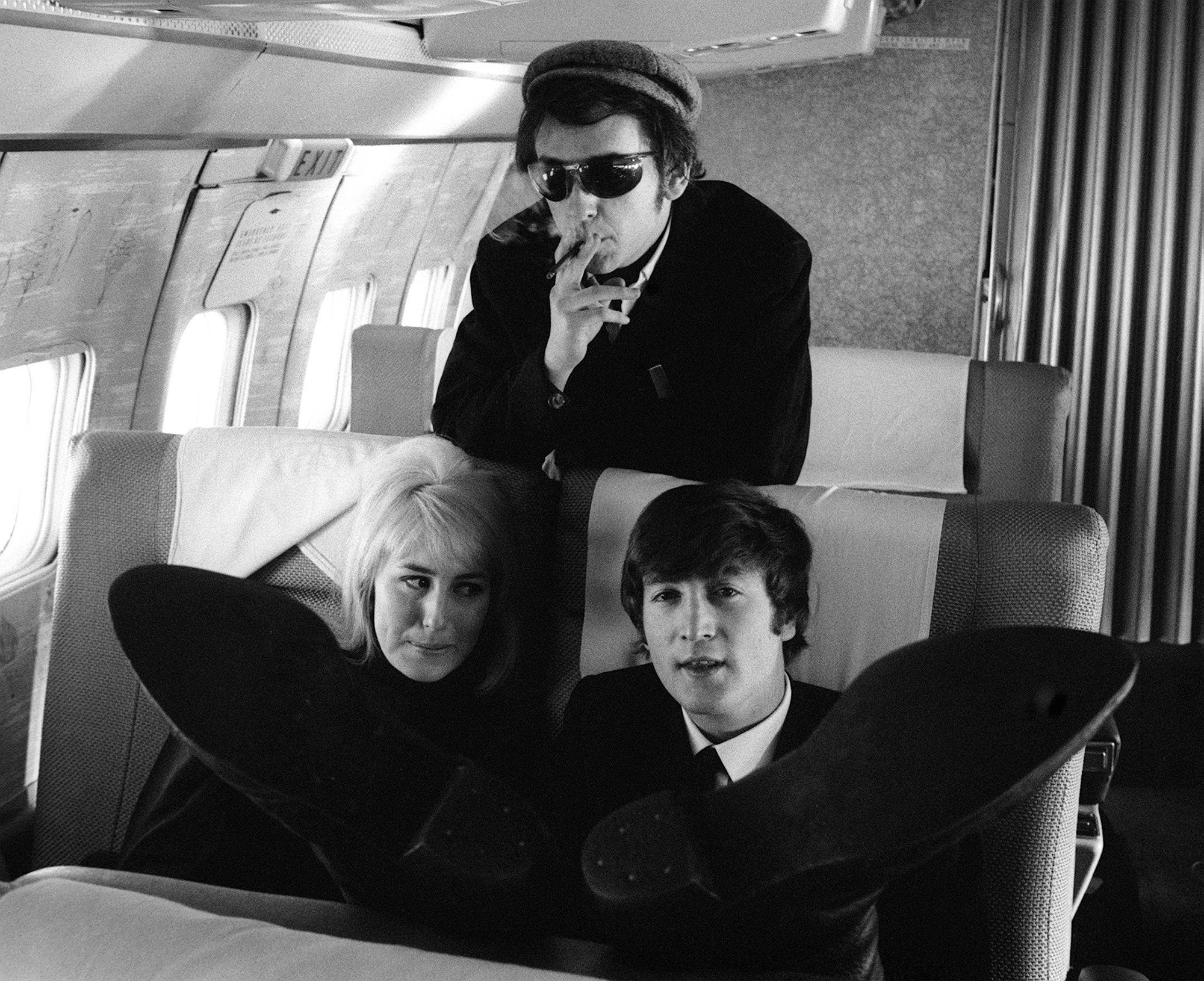 John Lennon, Cynthia Lennon &amp; recording manager Phil Spector travel to New York. 7th February 1964.