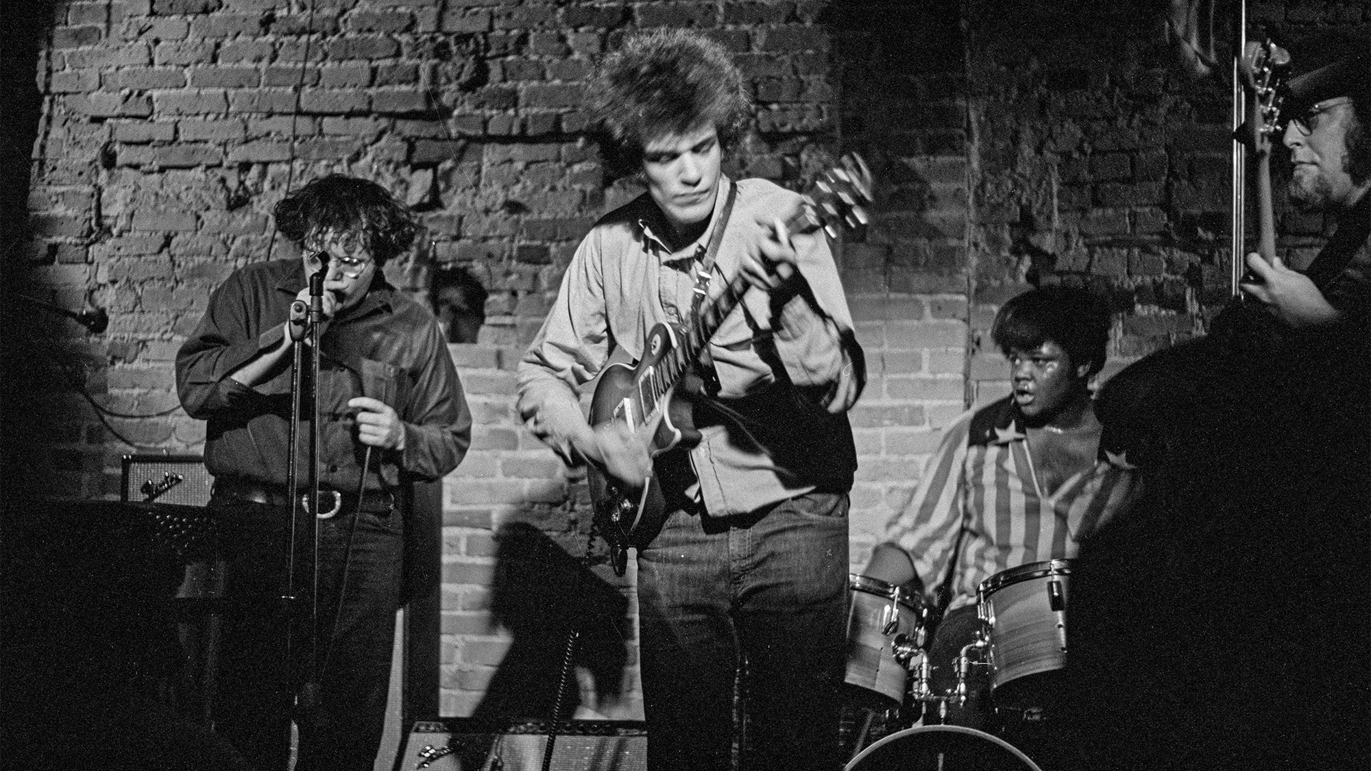 American blues rock group The Electric Flag perform at The Bitter End in New York City, circa 1967. From left to right, singer Nick Gravenites, guitarist Mike Bloomfield, drummer Buddy Miles and bassist Harvey Brooks.