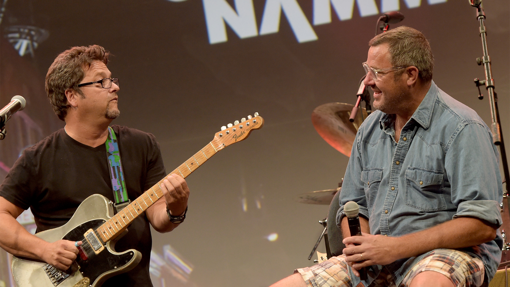 Brent Mason chats Vince Gill during Vince Gill Hosts "Insight: Iconic Artists And The Gear That Inspires Them" To Kick Off Summer NAMM, July 17-19 In Nashville at Music City Center on July 16, 2014 in Nashville, Tennessee.