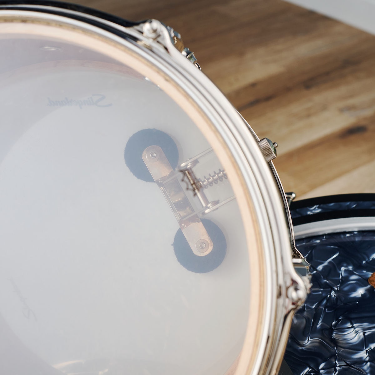 Slingerland Radio King snare drum damper seen through the resonant head