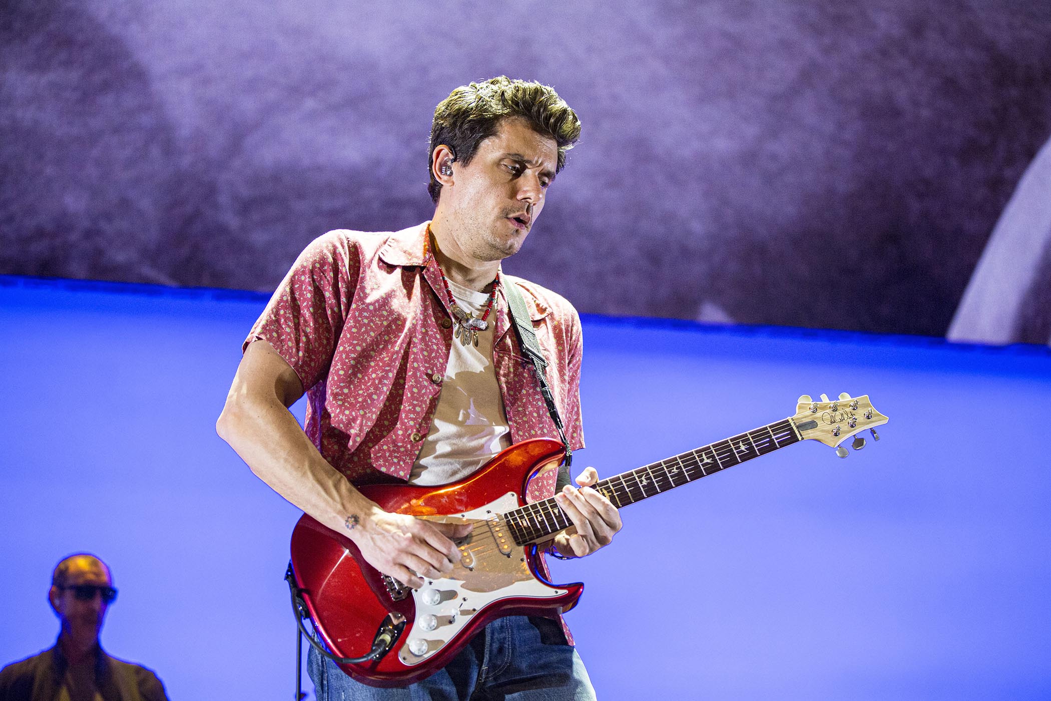 John Mayer plays a red Silver Sky live in 2019, and it kind of matches his shirt.