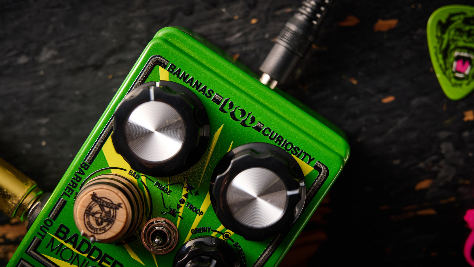 The DOD Badder Monkey is another little green overdrive pedal &ndash; but like no other. Pictured here against a distressed wooden floor, it has a wooden barrel control, and a primate illustration on the front.