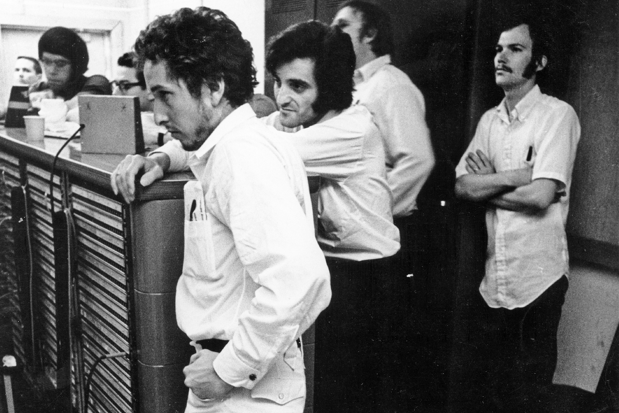 Bob Dylan listens intently in the recording booth during the recording of his album "Self Portrait" whiled Doug Kershaw looks on on May 3, 1969 in Nashville, Tennessee.