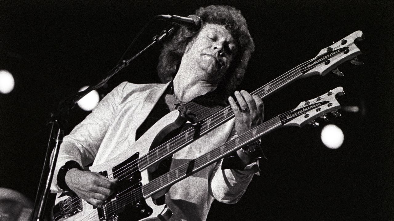 John Lodge performs on stage at Ahoy, Rotterdam, Netherlands, 30th May 1981. He is playing a Rickenbacker double necked guitar.