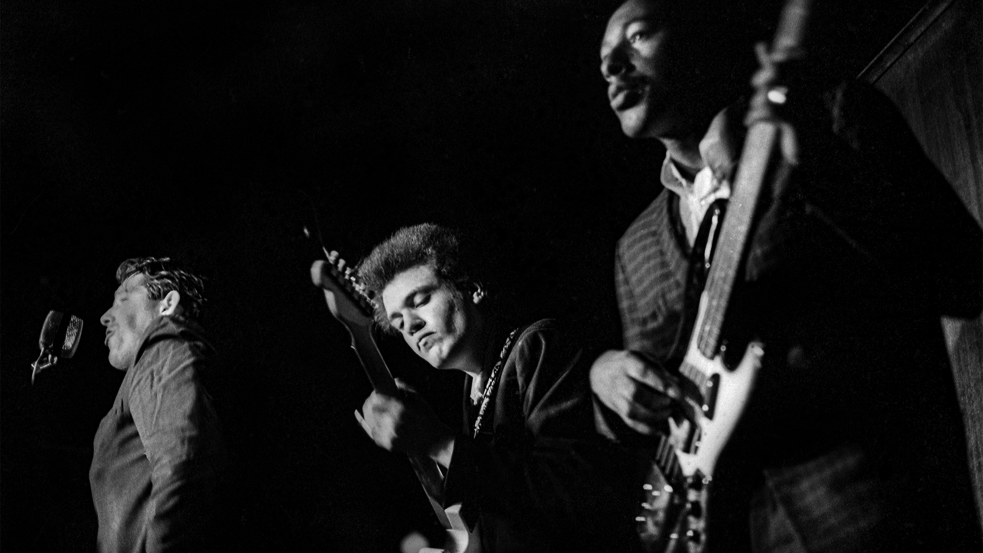 NEW YORK - CIRCA 1966: Guitarist Mike Bloomfield, Paul Butterfield and bassist Jerome Arnold of the Butterfield Blues Band perform circa 1966 in New York City, New York.