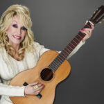 Dolly Parton on the little guitar behind her big music career