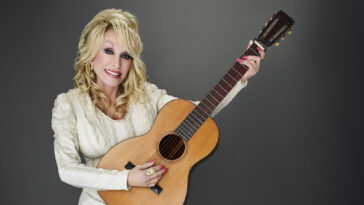 Dolly Parton on the little guitar behind her big music career